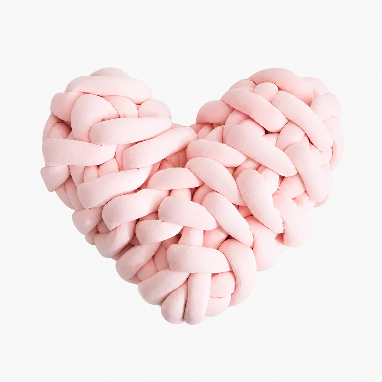 Heart-shaped pillow motif in coarse knit for a cozy home