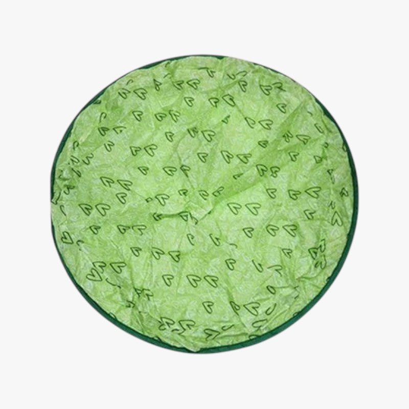 Roselva interactive cat toy featuring a round green nylon surface with a heart pattern for feline hunting play