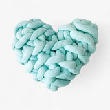 Heart-shaped pillow motif in coarse knit for a cozy home