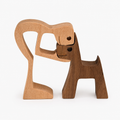 Wooden sculpture of person with dog, minimalist home decoration