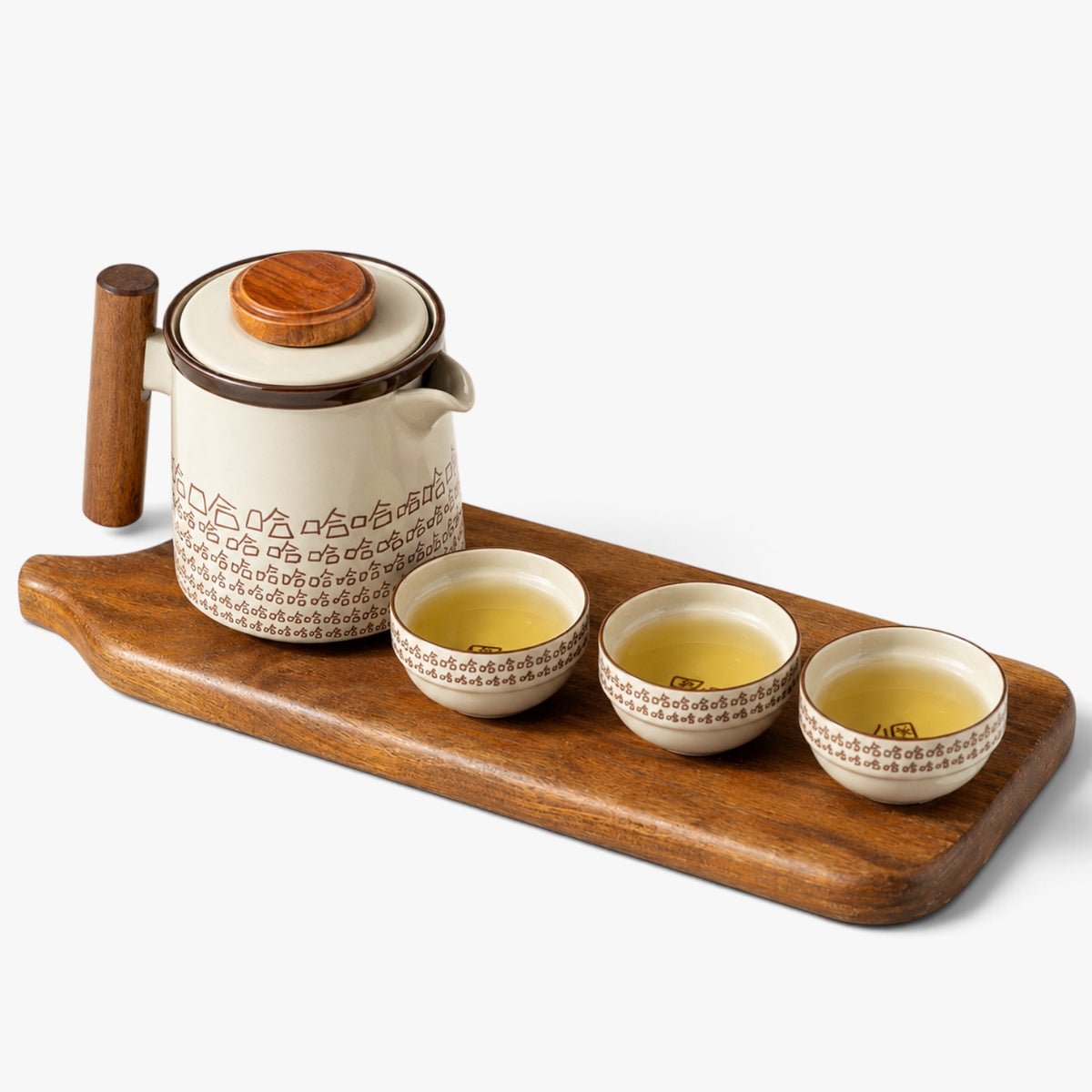 Roselva portable ceramic tea set with teapot and three cups featuring brown geometric patterns on a wooden serving board