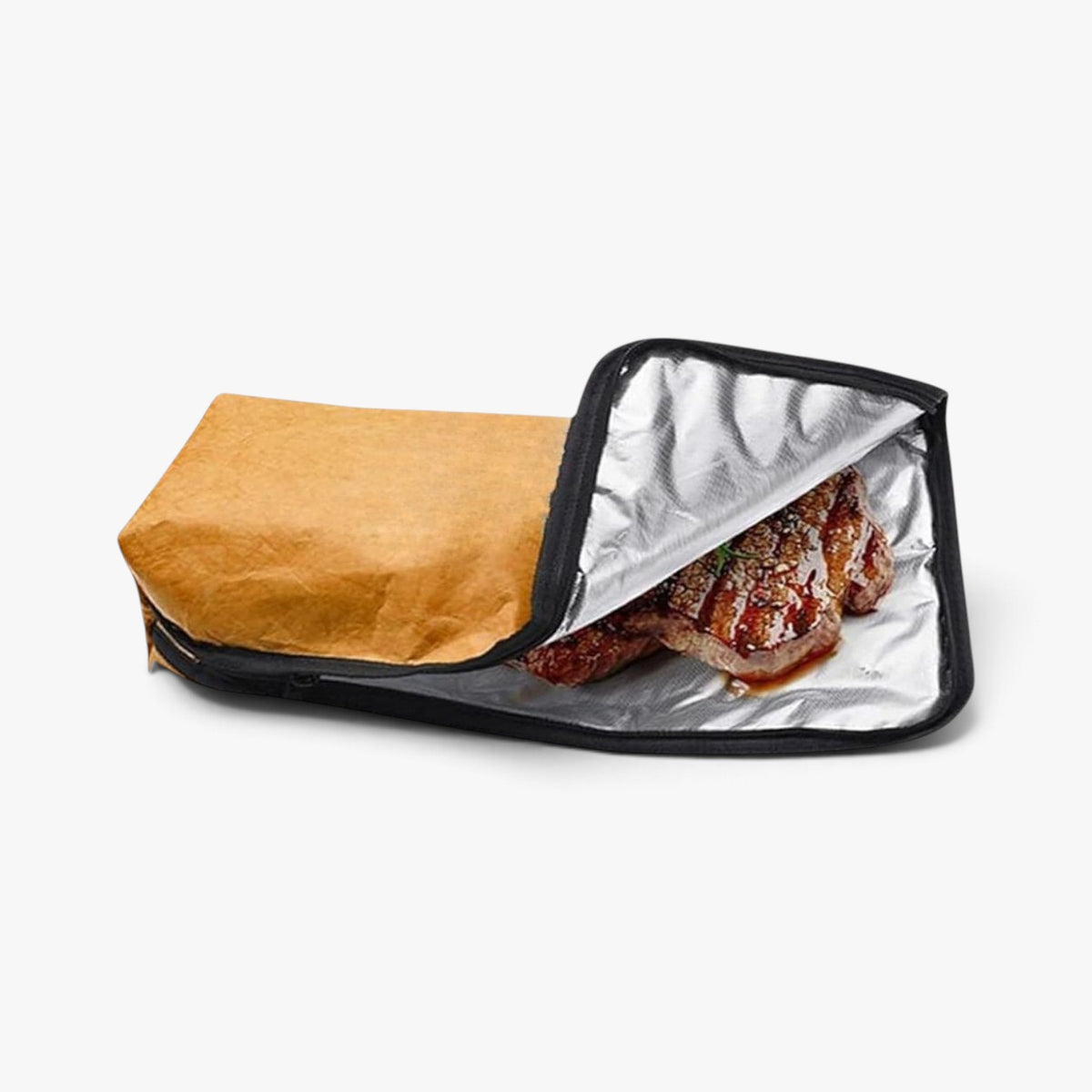 Roselva insulated BBQ meat resting bag with a tan exterior and silver foil interior holding a cooked steak