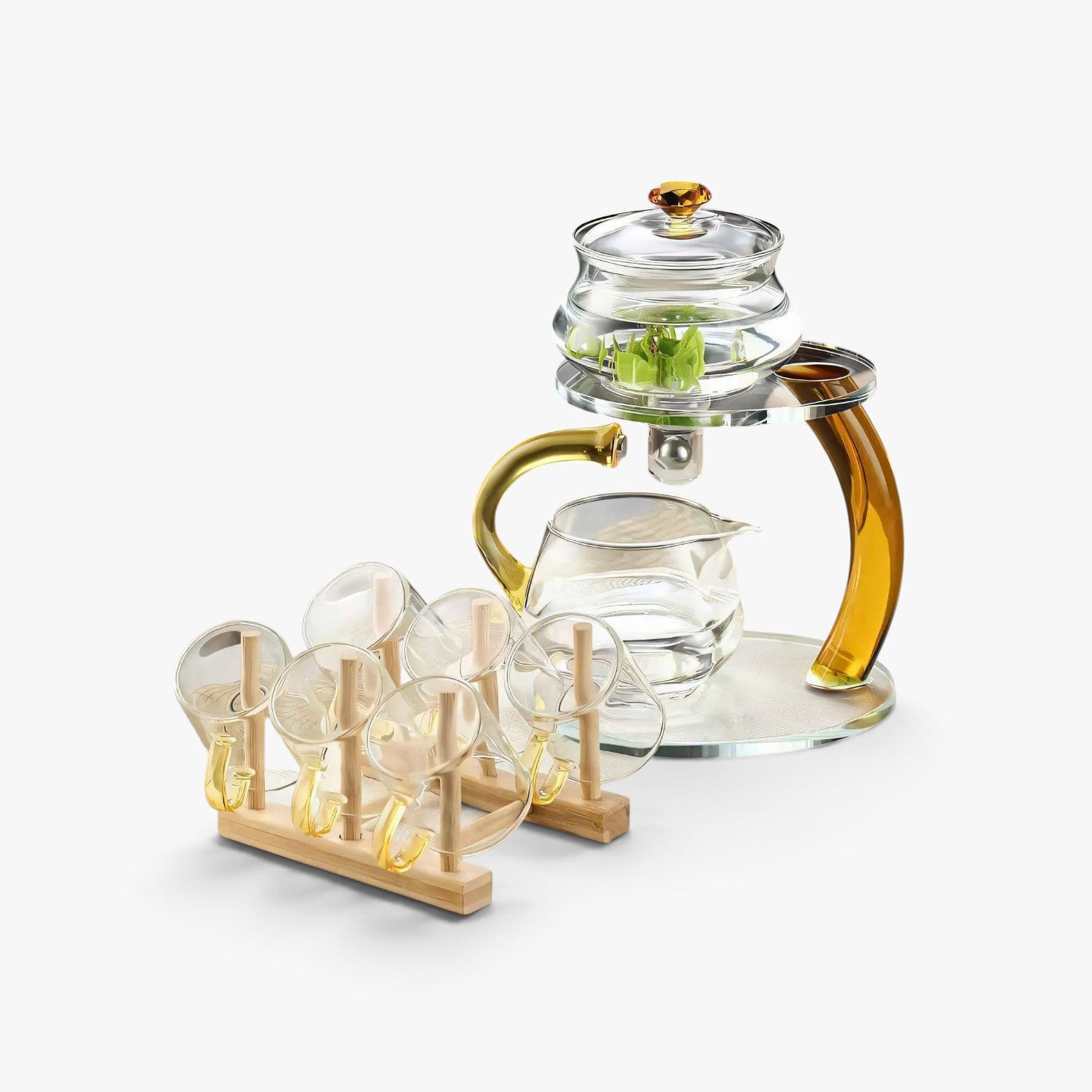 Roselva TranquiliTea magnetic infuser teapot set with clear glass cups and gold accents on a wooden drying rack.
