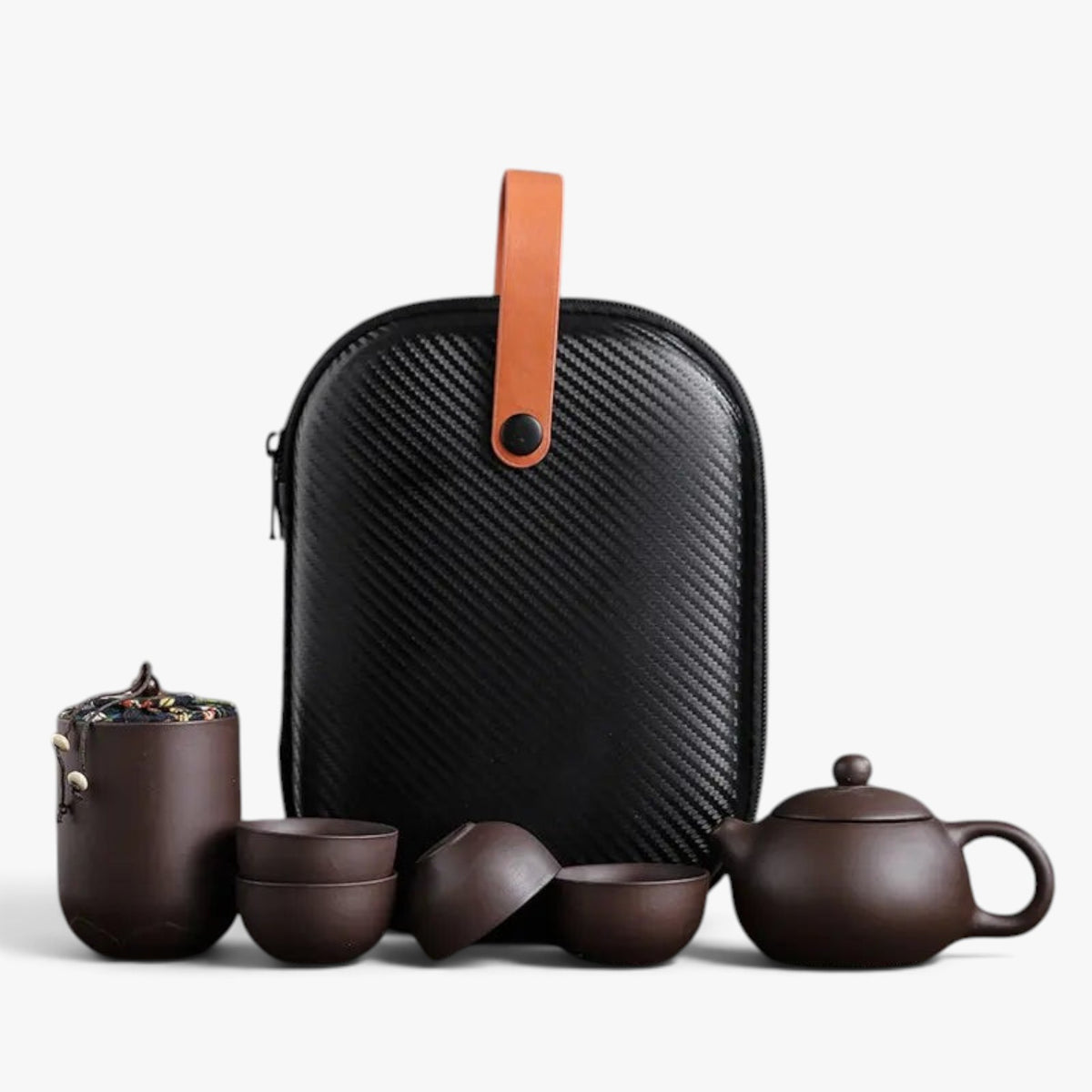 Roselva traditional travel tea set with dark brown ceramic teapot, four cups, storage jar, and protective carry case.