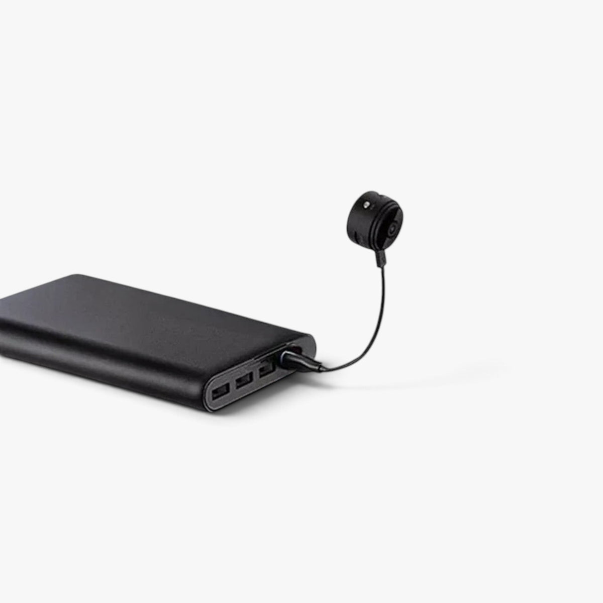 Roselva wireless backup camera connected to a black portable power bank for charging